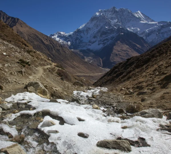 Snow-covered trekking path on the Manaslu Circuit route in Nepal