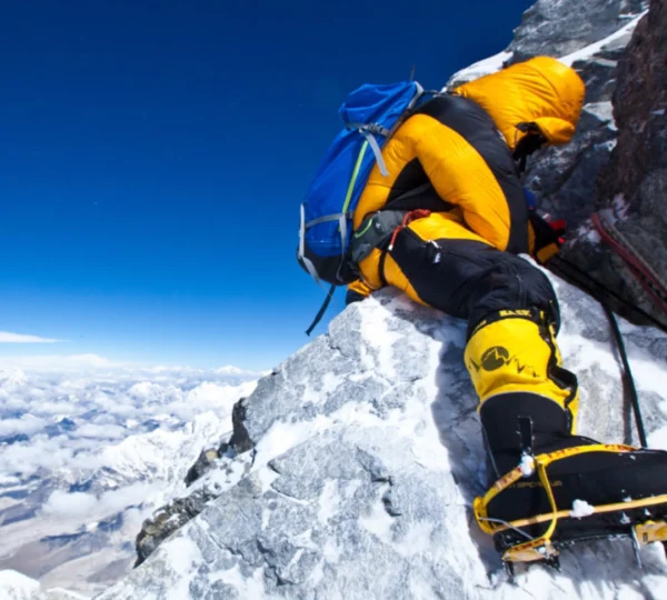 Mountaineer climbing toward the summit on a high-altitude Mt Everest